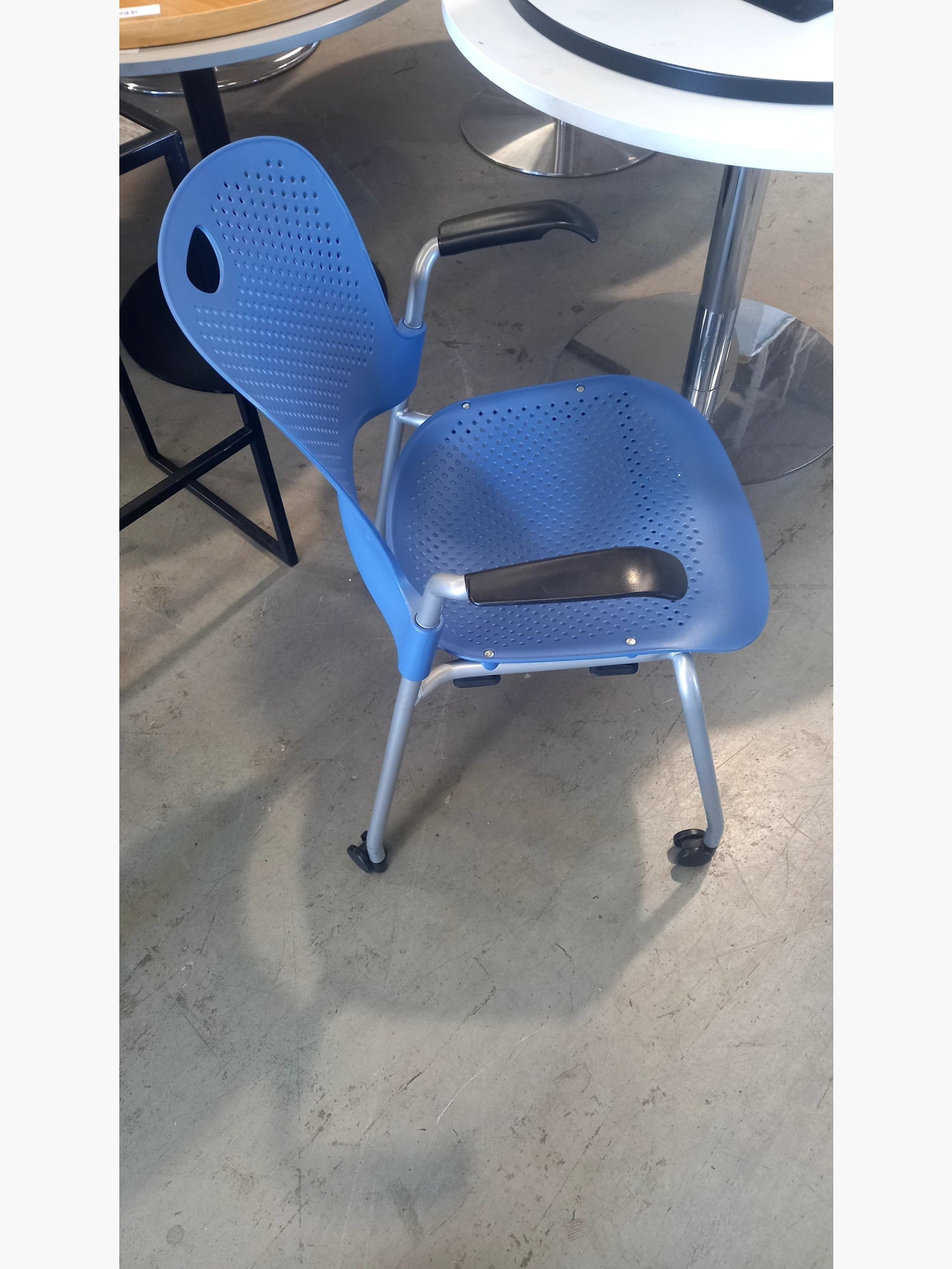 Herman Miller - Stack Chair With Arms On Wheels Blue stacking chairs