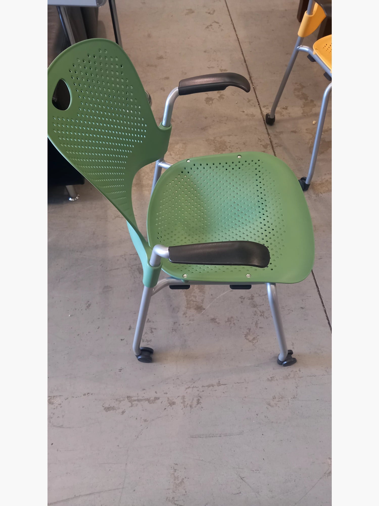 Herman Miller - Stack Chair With Arms On Wheels Green stacking chairs