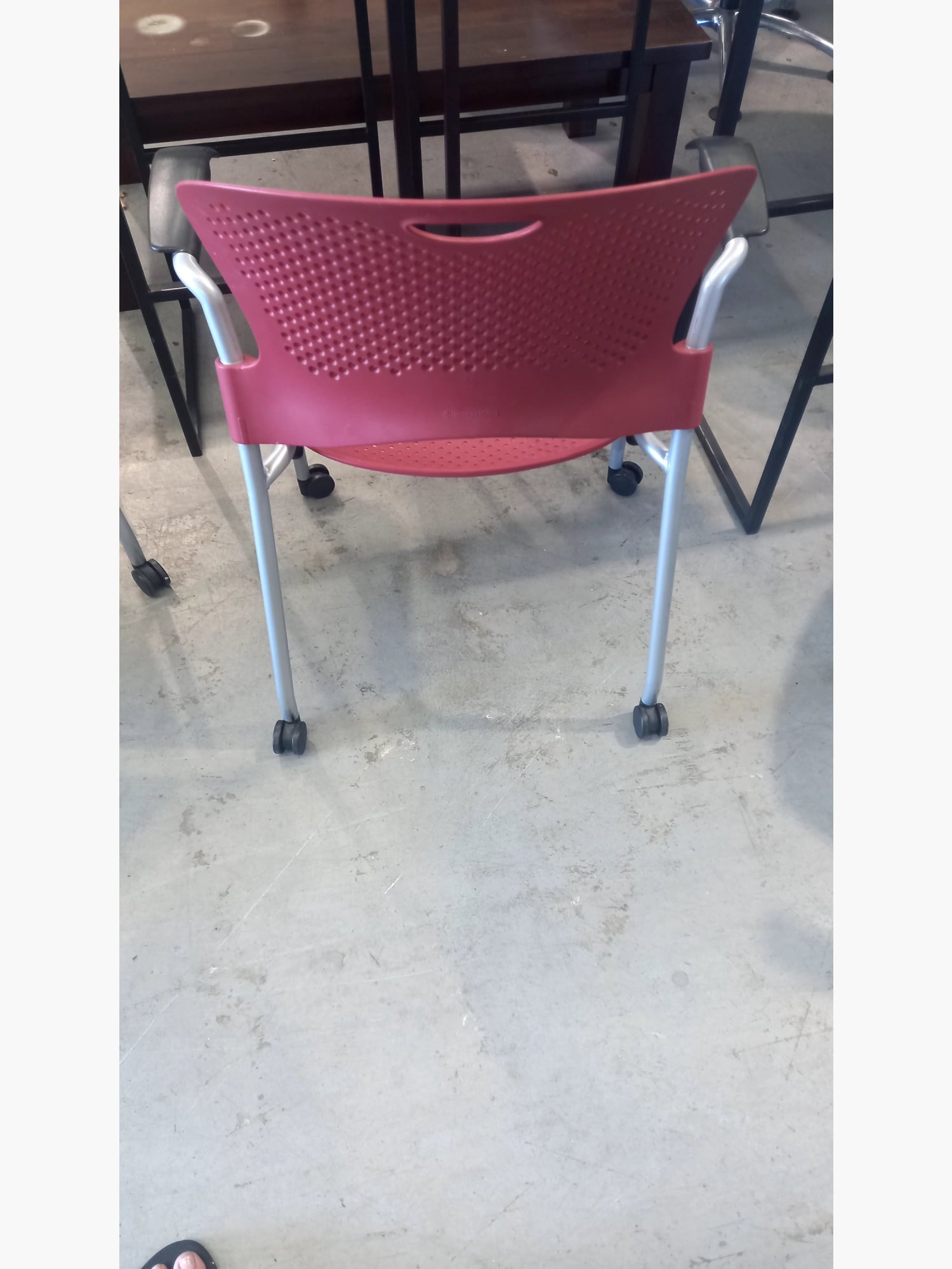 Herman Miller - Stack Chair With Arms On Wheels Dark Red stacking chairs