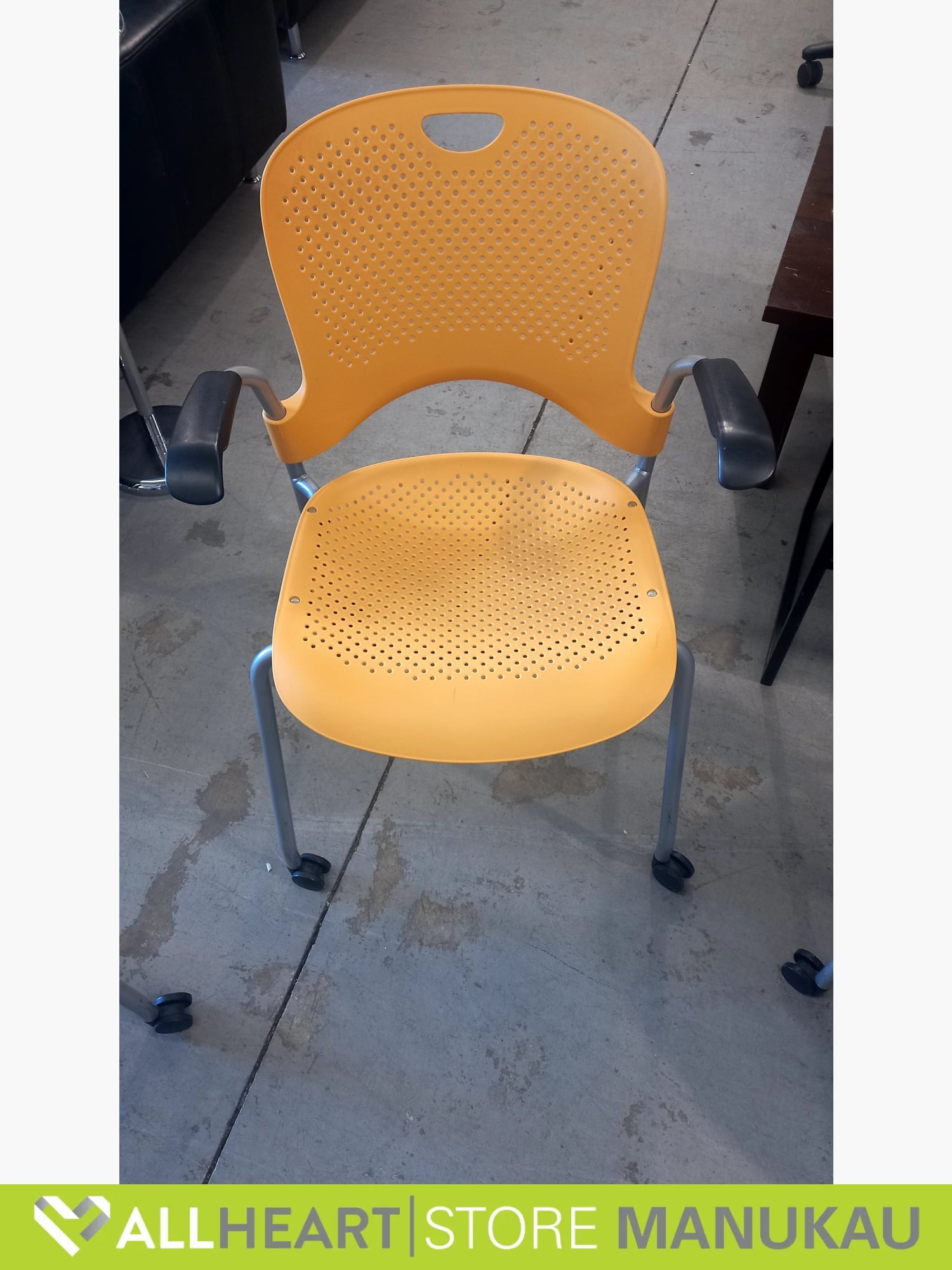 Herman Miller - Stack Chair With Arms On Wheels Yellow stacking chairs